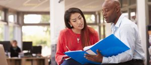 A NYIM financial aid advisor counsels a student in Williamsville, New York